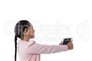 Girl using digital tablet against white background