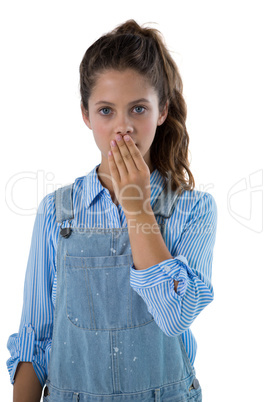 Teenage girl standing against white background