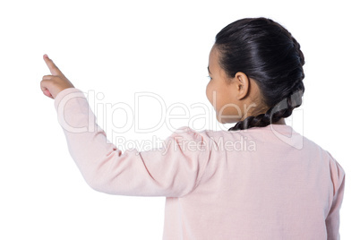 Girl pressing an invisible virtual screen against white background