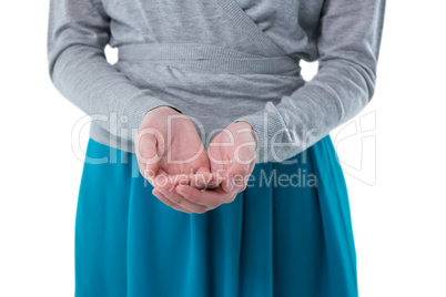 Teenage girl pretending to hold invisible object