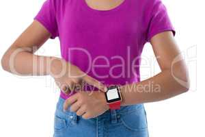 Teenage girl using smartwatch against white background