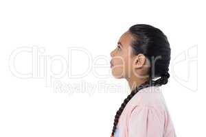 Thoughtful girl standing against white background