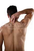 Rear view of shirtless player suffering from neck pain
