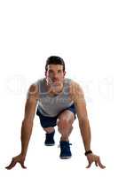Determined sports player in running position