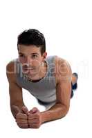 Determined sports player exercising planks