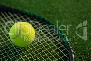 Close up of tennis ball on racket