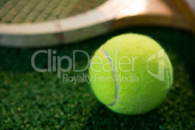 Close up of tennis ball with racket