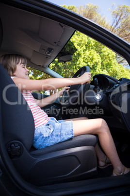 Teenage girl driving a car