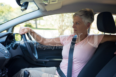 Senior woman driving a car