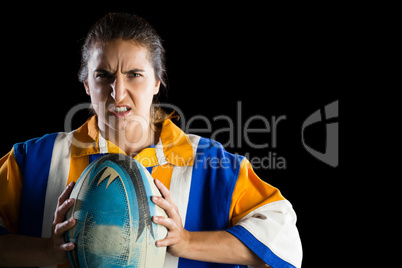 Portrait of aggressive female rugby player