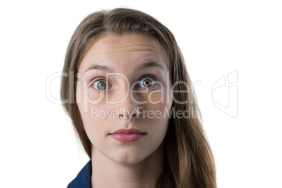 Confused teenage girl looking at camera