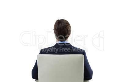 Businessman looking at invisible virtual screen against white background