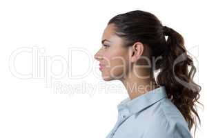 Female executive standing against white background