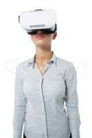 Female executive using virtual reality headset