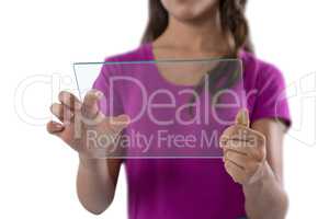 Girl using glass digital tablet against white background