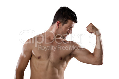 Determined shirtless sportsman flexing muscles