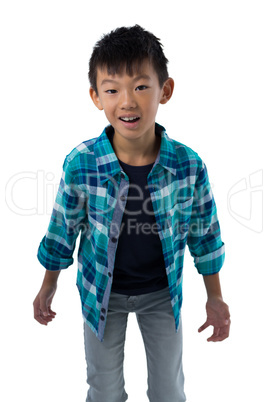 Boy standing against white background