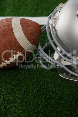 High angle view of American football by sports helmet