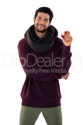 Portrait of smiling man holding apple