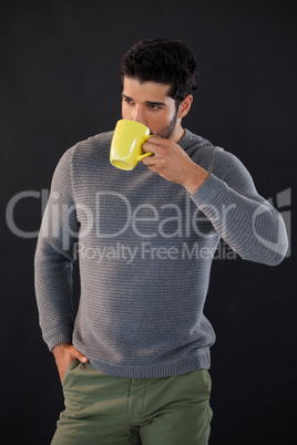 Thoughtful man having a mug of coffee