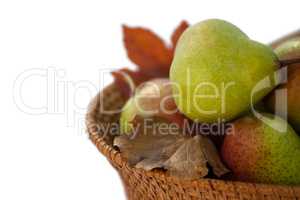 Close-up of pears in wicker basket