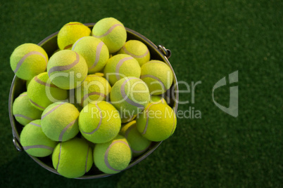 High angle view of tennis balls in bucket
