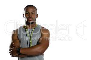 Portrait of male trainer with arms crossed
