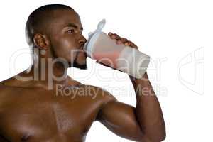 Close up of shirtless sportsman having energy drink