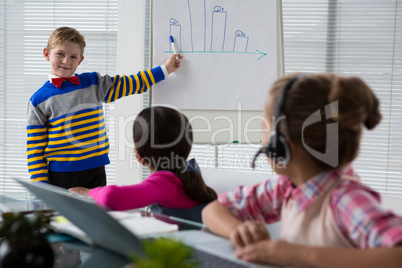 Boy as business executive presenting