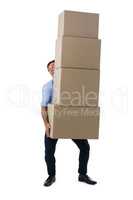 Male executive carrying stack of cardboard boxes