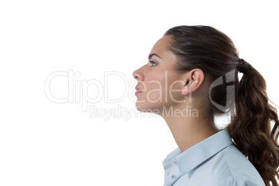 Female executive standing against white background