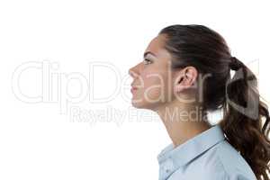 Female executive standing against white background