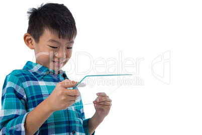 Boy using a glass digital tablet