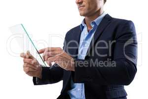 Businessman using a glass digital tablet
