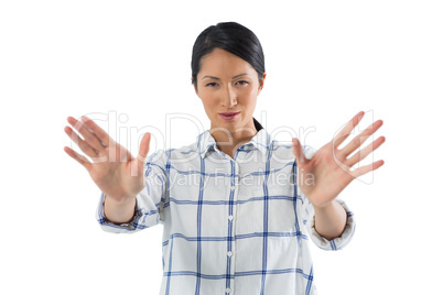 Female executive gesturing against white background