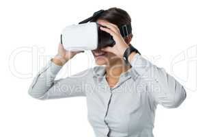 Female executive using virtual reality headset