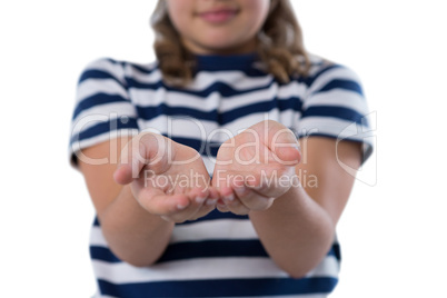 Mid section of girl pretending to be holding invisible object