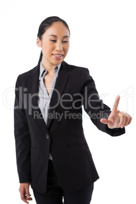 Businesswoman pressing an invisible virtual screen