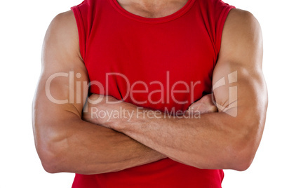 Midsection of sports player with arms crossed