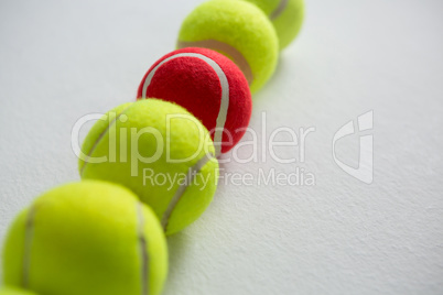High angle view of tennis balls arranged in row