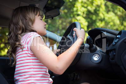 Teenage girl driving a car