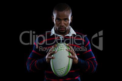 Portrait of male rugby player with ball