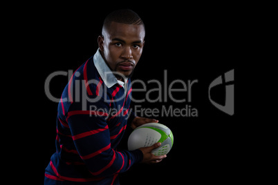 Portrait of male athlete with rugby ball