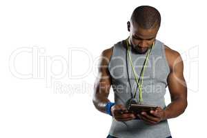 Male rugby instructor using digital tablet