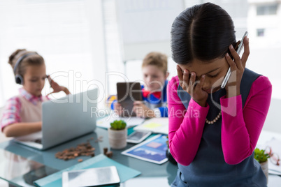 Girl as business executive talking on mobile phone