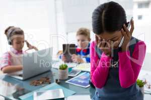 Girl as business executive talking on mobile phone