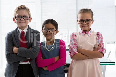 Kids as business executive smiling while standing in the office