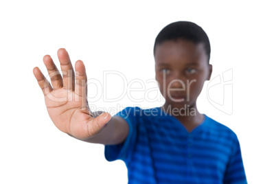 Boy showing stop sign