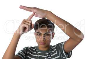 Boy making a timeout hand gesture