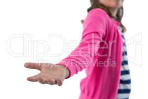 Mid section of girl pretending to be holding invisible object